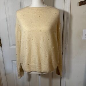 H&M pearl detail sweater in cream color.